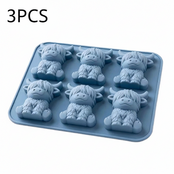 light blue silicone mold shaped like Highland cows, shown on a plain white background with a '2PCS' text overlay in the top left corner.